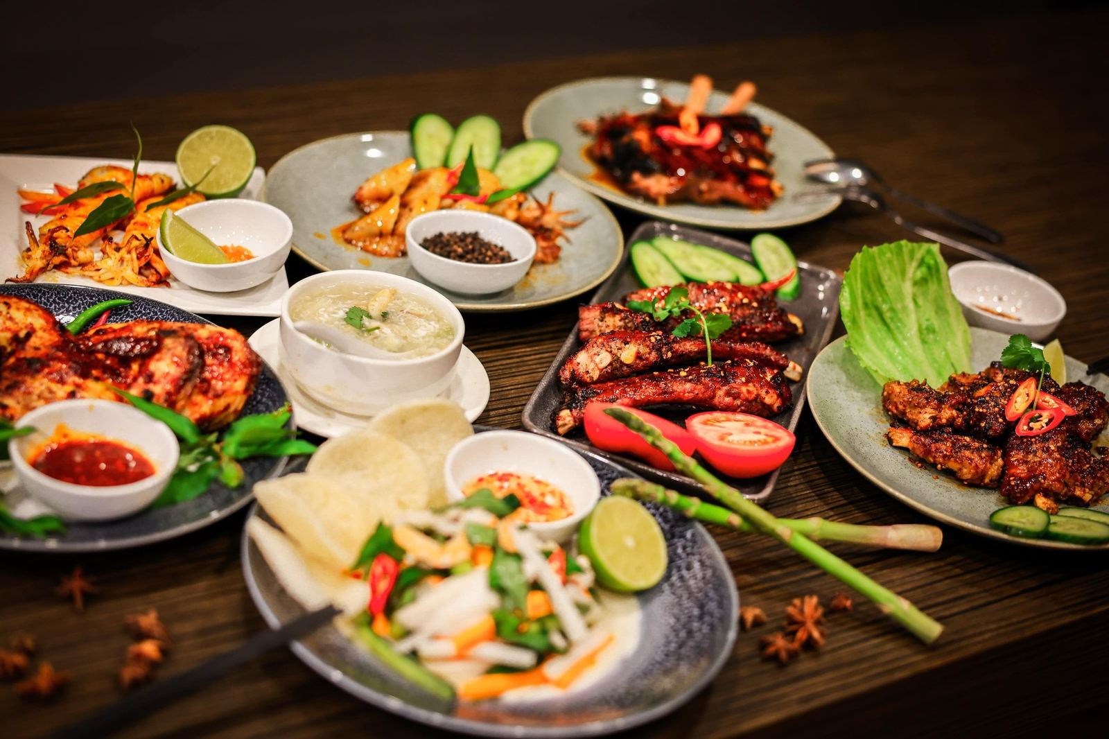 A table spread with Ruby's grilled meats, salads, rice and dipping sauces