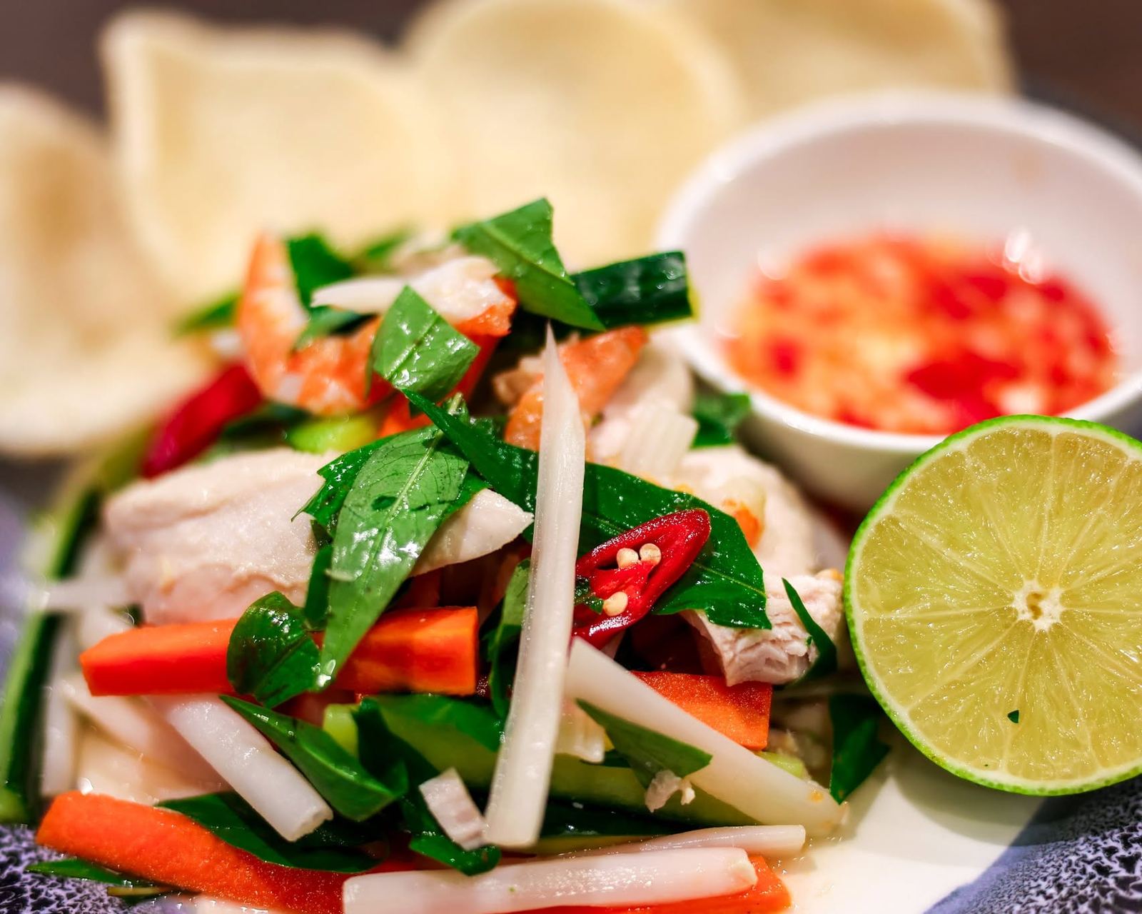 Vietnamese salad with herbs, chilli, lime and prawn crackers
