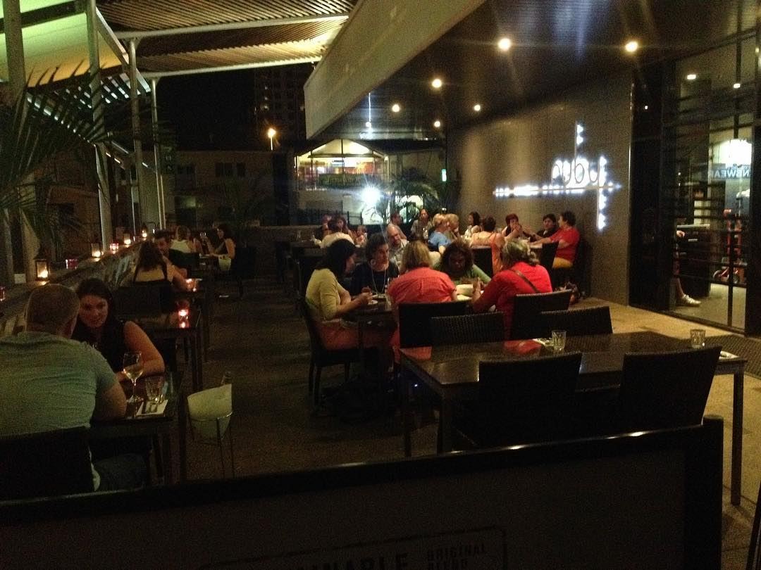 Ruby's dining room at night, lit and full